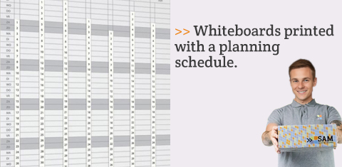 Whiteboards printed with a planning schedule.