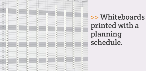 Whiteboards printed with a planning schedule.